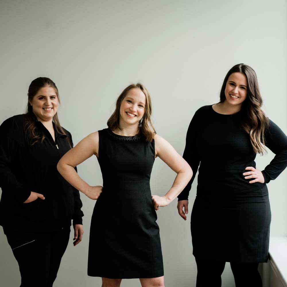 Photo of Acton dentist, Dr. Jenny Citrin, standing with two team members