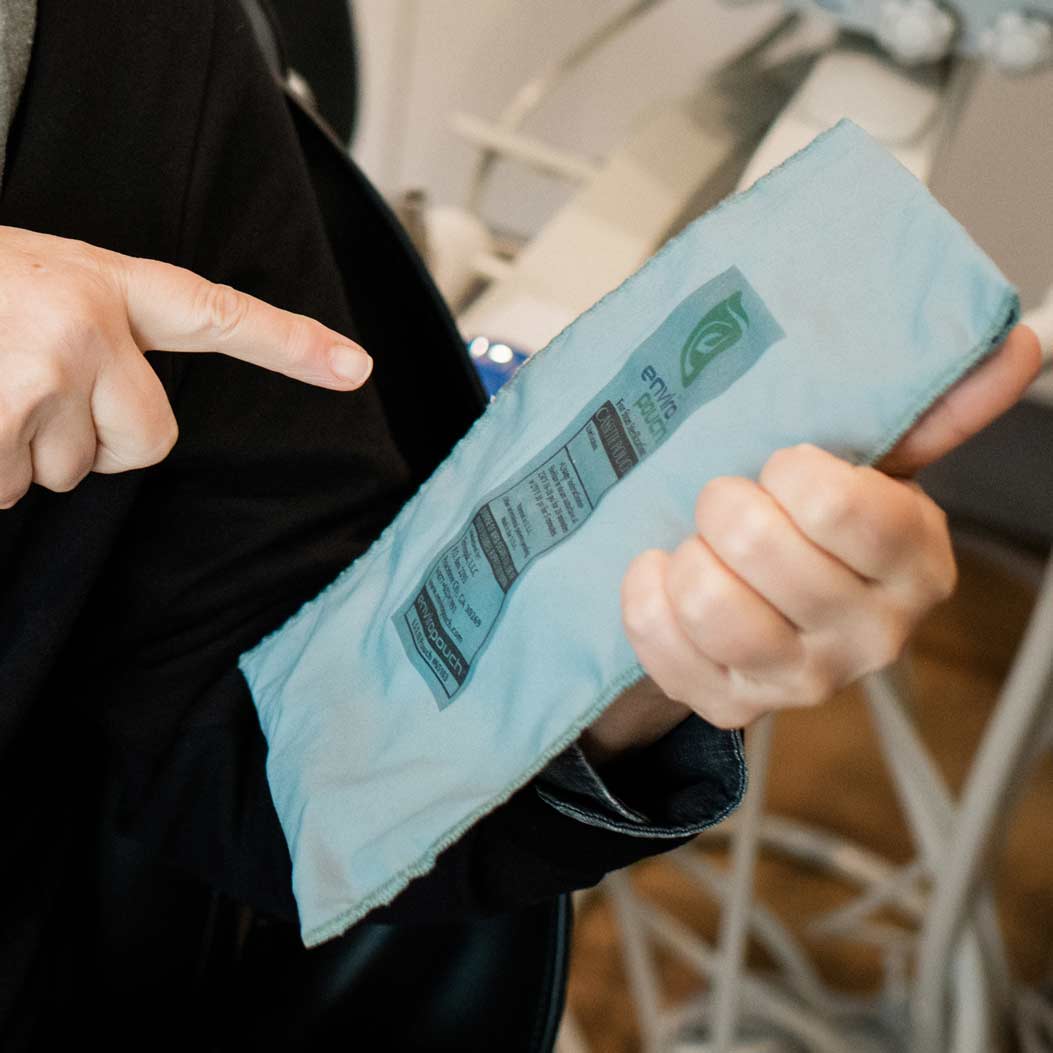Photo of a team member holding an eco-friendly package