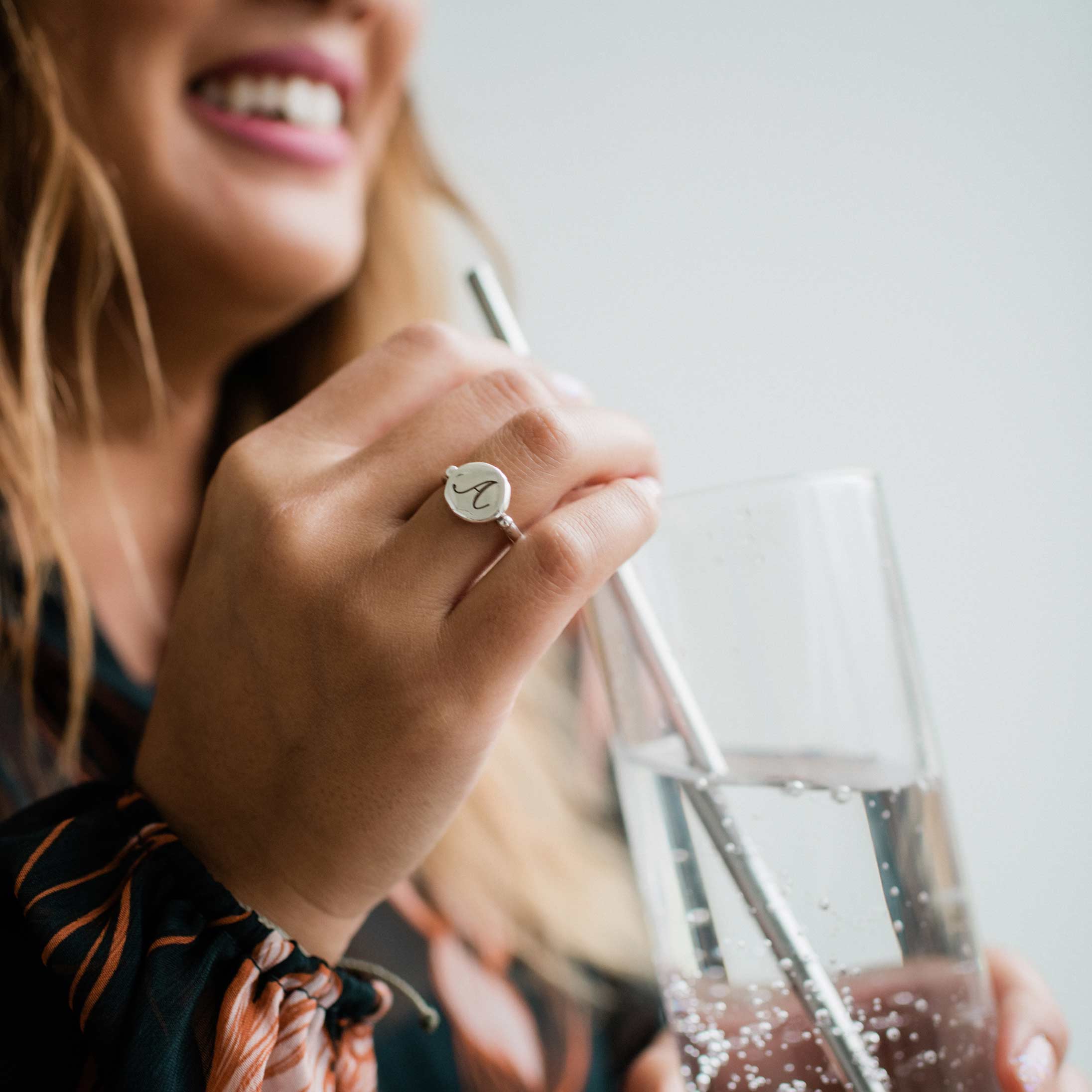 Photo of a patient holding a glass of water