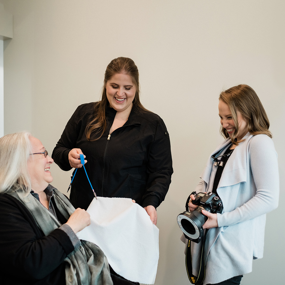 Photo of Acton Dentist, Jenny Citrin, talking with a patient while holding an iPad