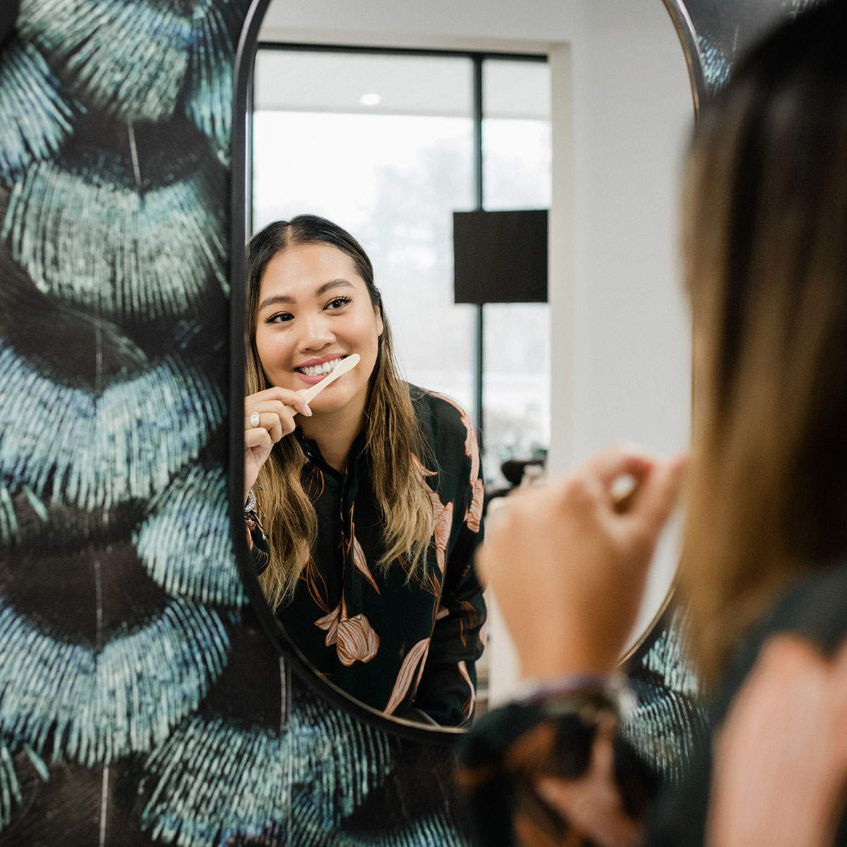 Photo of a Thrive Dental Co. notebook with a bamboo toothbrush sitting on top
